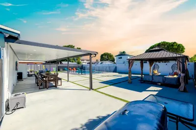 a patio with a table and a gazebo at Havana Blue/Pool+Heater/Hard Rock/Gazebo/BBQ in Miami