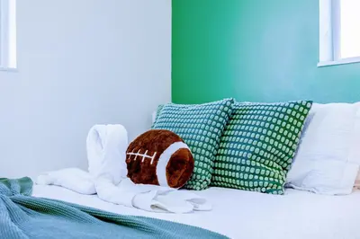 a bed with pillows and a stuffed animal on it at Havana Blue/Pool+Heater/Hard Rock/Gazebo/BBQ in Miami