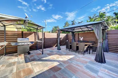 a patio with a gazebo and a grill at Walk to Beach Luxury 4BR & 4BA Villa Hollywood Lakes in Hollywood