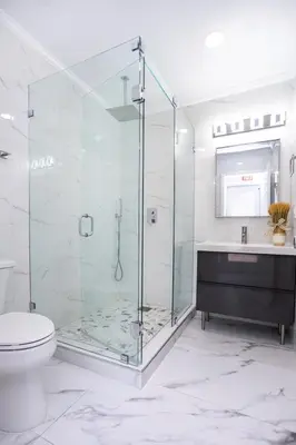 a bathroom with a shower and a toilet and a sink at Breathtaking 5BR & 3BA Villa near Hollywood Beach in Hollywood