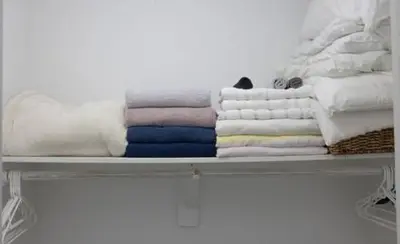 a shelf with folded towels on it at Komffy Apt w/2 Queen Beds & Canal View at Tides in Hollywood