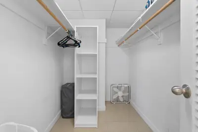 a hallway with white walls and a white stair case at PROMO Komffy Penthouse w King Bed and Ocean view at Tides 16th floor in Hollywood