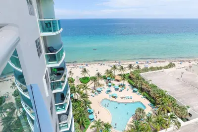 an aerial view of a resort with a pool and the beach at PROMO Komffy Penthouse w King Bed and Ocean view at Tides 16th floor in Hollywood