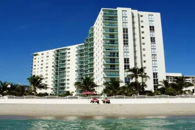 a large building on the beach with a building at PROMO Komffy Penthouse w King Bed and Ocean view at Tides 16th floor in Hollywood