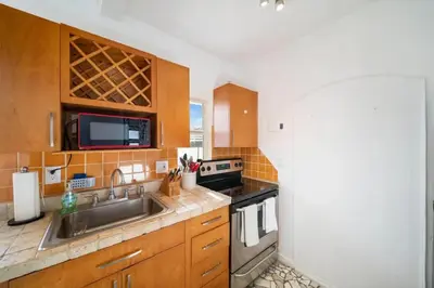 a kitchen with a sink and a microwave at Waterside Escape w/Queen Bed & Free Parking in Hollywood