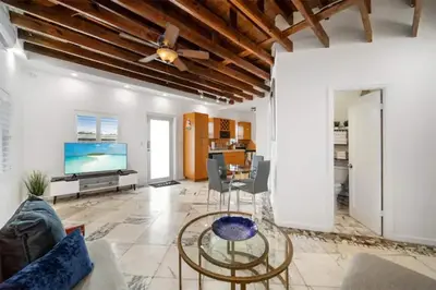 a living room with a ceiling fan and a table at Waterside Escape w/Queen Bed & Free Parking in Hollywood