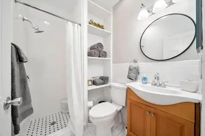 a bathroom with a toilet and a sink and a mirror at Komffy Intercoastal retreat King Bed, Free Parking in Hollywood