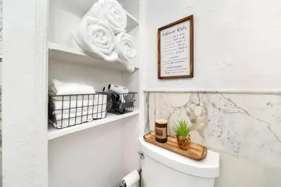 a bathroom with a toilet with a plant on it at Komffy Intercoastal retreat King Bed, Free Parking in Hollywood