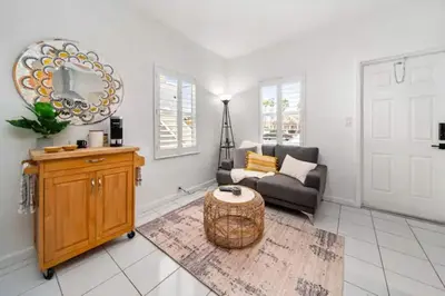 a living room with a couch and a table at Komffy Intercoastal retreat King Bed, Free Parking in Hollywood