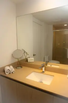 a bathroom with a sink and a large mirror at Luxury 2 Bedroom Ocean View en Hyde Resort in Hollywood