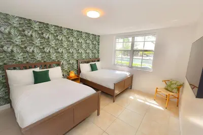 a bedroom with two beds and a window at 2 Luxury Bedrooms at Yacht Club de Aventura in Miami