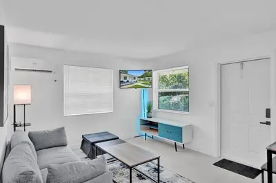 a living room with a couch and a table at Hallandale Beach Modern apartment Chic Backyard in Hallandale Beach