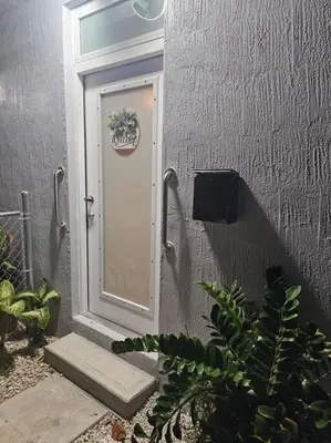 a door with a plant in front of a building at D&N Property Rental in Miami