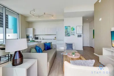 a living room with a couch and a table at Ocean and Beach View Luxury Pet-Friendly in Hollywood