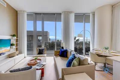 a living room with a couch and a table at Ocean and Beach View Luxury Pet-Friendly in Hollywood