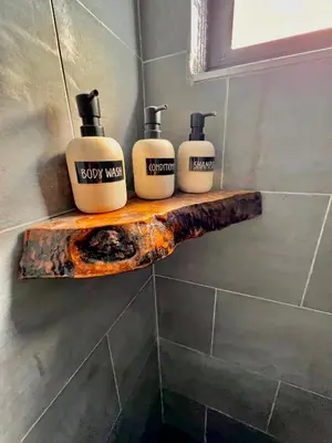 three bottles of soap on a wooden shelf in a bathroom at Casa Olan - Luxury Family Oasis 3BR North Miami Beach Villa with Saltwater Pool & Canal Views in Miami