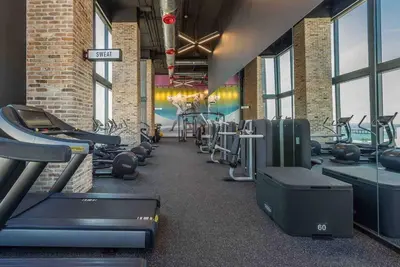 a gym with several treadmills and cardio machines at Luxurious Unit in Miami in Miami