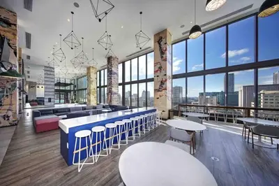 a large room with tables and chairs and windows at Luxurious Unit in Miami in Miami