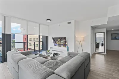 a living room with a couch and large windows at Exceptional property in the heart on downtown Miami in Miami