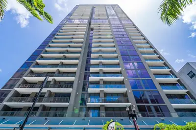 a tall building with blue sky in the background at Exceptional property in the heart on downtown Miami in Miami