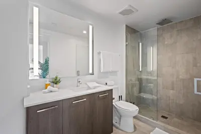 a bathroom with a toilet and a sink and a shower at Majestic unit in the heart of Downtown Miami in Miami