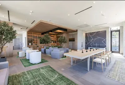 a dining room with a table and white chairs at Blueground Wynwood pool gym nr Design Dist MIA-99 in Miami