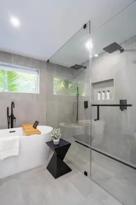 a bathroom with a tub and a sink and a shower at 5BR HotTubPoolTableMiniGolf 7 min to Wynwood in Miami