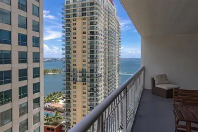 a balcony of a building with a view of the water at Entire Condo in Brickell steps from Brickell City Centre in Miami