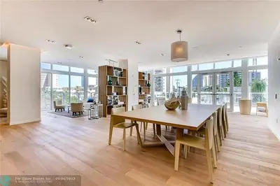 a dining room with a wooden table and chairs at The Glamour of Upscale Downtown Ft. Lauderdale in Fort Lauderdale