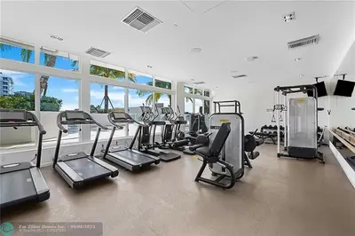 a gym with a lot of treadmills and machines at The Glamour of Upscale Downtown Ft. Lauderdale in Fort Lauderdale