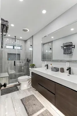a bathroom with a sink and a toilet and a shower at Miami Oasis, Spacious 4-Bedroom Home with Pool in Miami