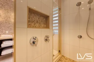 a bathroom with a shower and a toilet and a sink at Victoria Villa - Walk to Las Olas - 4 Bed 4 Bath in Fort Lauderdale
