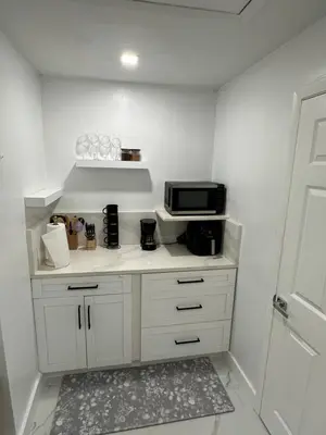 a kitchen with a counter with a microwave on it at Adrien Guest Studio in Miami Gardens