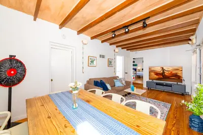 a living room with a table and a couch at Art Deco Washingthon Apartment in Miami Beach