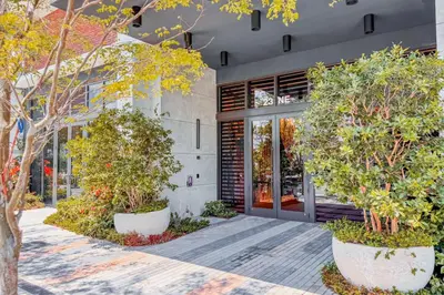 an entrance to a building with trees in front of it at Blueground Wynwood gym roof pool nr Midtown MIA-101 in Miami