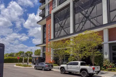 a white truck parked in front of a building at Blueground Wynwood gym roof pool nr Midtown MIA-101 in Miami