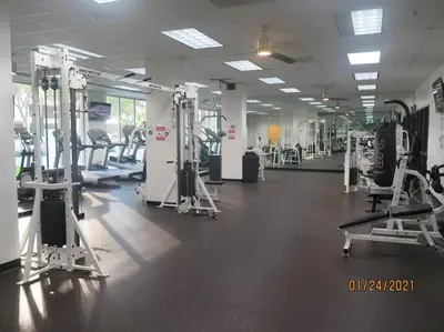 a gym with several tread machines in a room at Cozy newly furnished apartment , on the 6th floor. in Sunny Isles Beach