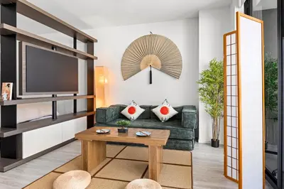 a living room with a couch and a tv at Breezy Stays Luxury Residences - near Kaseya Center in Miami