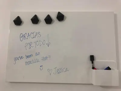 a white board with writing on a wall at Cozy Studio Apartment in Miami