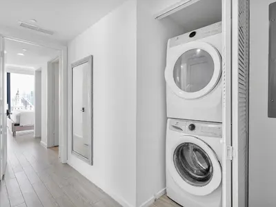 a washer and dryer in a white room at X Lounge-Contemporary Corner Residence in Miami
