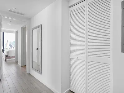 a room with white walls and a walk in closet at X Lounge-Contemporary Corner Residence in Miami