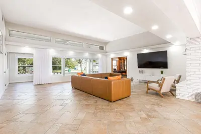 a living room with a couch and a tv at Tropical Waterfront Family Oasis - Amazing Location in Miami