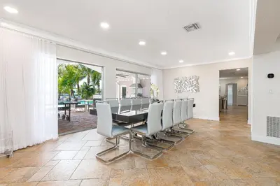 a dining room with a table and chairs at Tropical Waterfront Family Oasis - Amazing Location in Miami