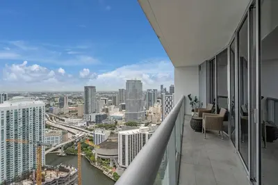a view of a city from the balcony of a building at Lovely 1BR W Icon Brickell-FREE SPA in Miami