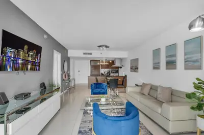 a living room with a couch and a table at Lovely 1BR W Icon Brickell-FREE SPA in Miami