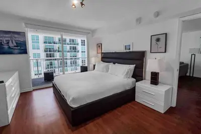 a bedroom with a large bed and a large window at Bay View 1 BDR 1 BTH • Brickell • Free Parking in Miami