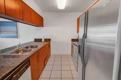 a kitchen with a stainless steel refrigerator at Bay View 1 BDR 1 BTH • Brickell • Free Parking in Miami