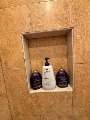 a bathroom shelf with a bottle of soap and two pumpkins at Deluxe Room in best location Miami in a 2 Bedrooms Unit - Parking, Laundry and Luggage Storage in Miami