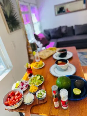 a wooden table with food on top of it at Deluxe Room in best location Miami in a 2 Bedrooms Unit - Parking, Laundry and Luggage Storage in Miami