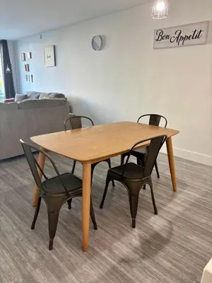 a wooden table and chairs in a room at #310 Sunny Isles Ocean Reserve with FREE Parking include in Sunny Isles Beach